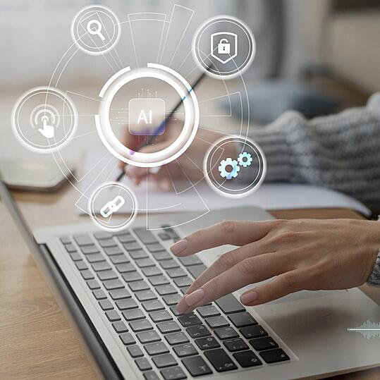 Photo d'une ordinateur portable avec une illustration AI.